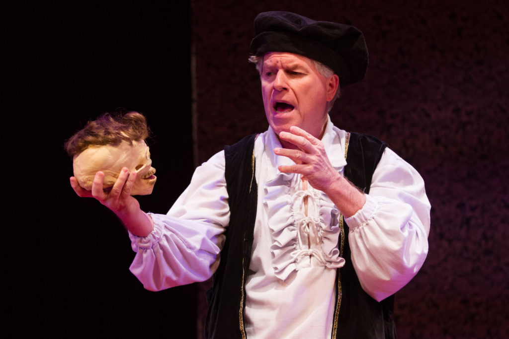 “Toupee, or not toupee?” asks the Prince of Demark (Austin Tichenor) in the Reduced Shakespeare Company’s William Shakespeare’s Long Lost First Play (abridged), at Folger Theatre, April 21 – May 8, 2016. Photo by Teresa Wood.