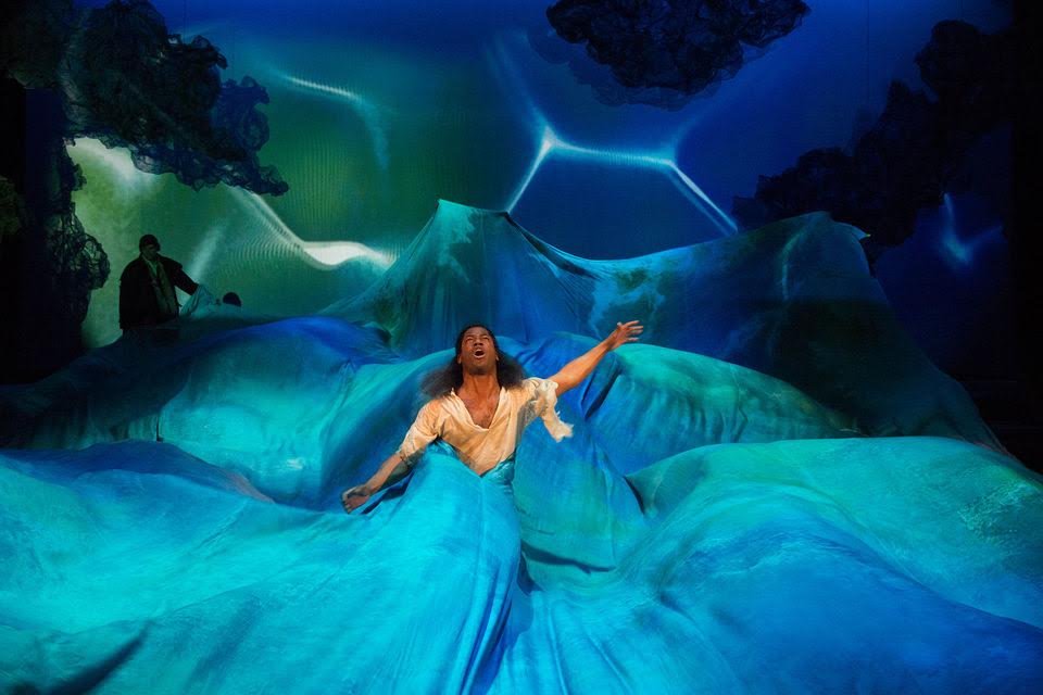 Pericles swathed in the silky blue waters of the Folger Shakespeare Library's production of Pericles by William Shakespeare
