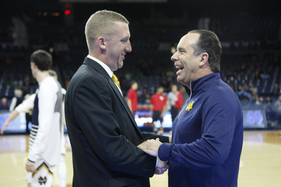 The coaches. Steve Howes for CUA and Mike Brey for Notre Dame interact before tip-off. Courtesy of cuacardinals.com