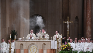 Father Alan Moran and other priests celebrate mass at the altar of the Basilica.